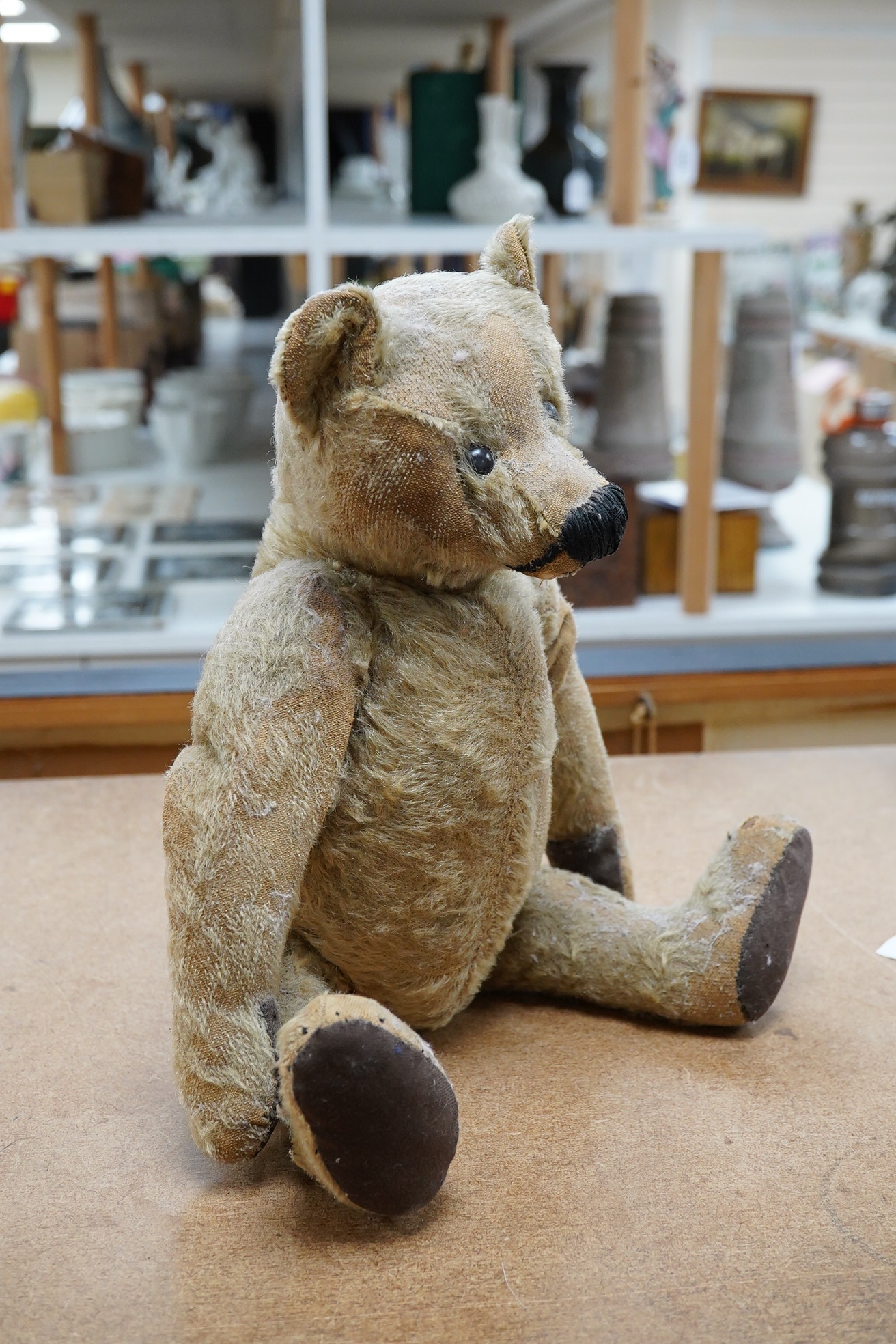 Steiff bear, circa 1910, nose repaired, holes to muzzle, hair loss, paw pads replaced, height 41cm